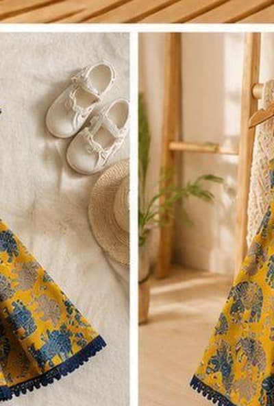 Mustard elephant print dress angled view